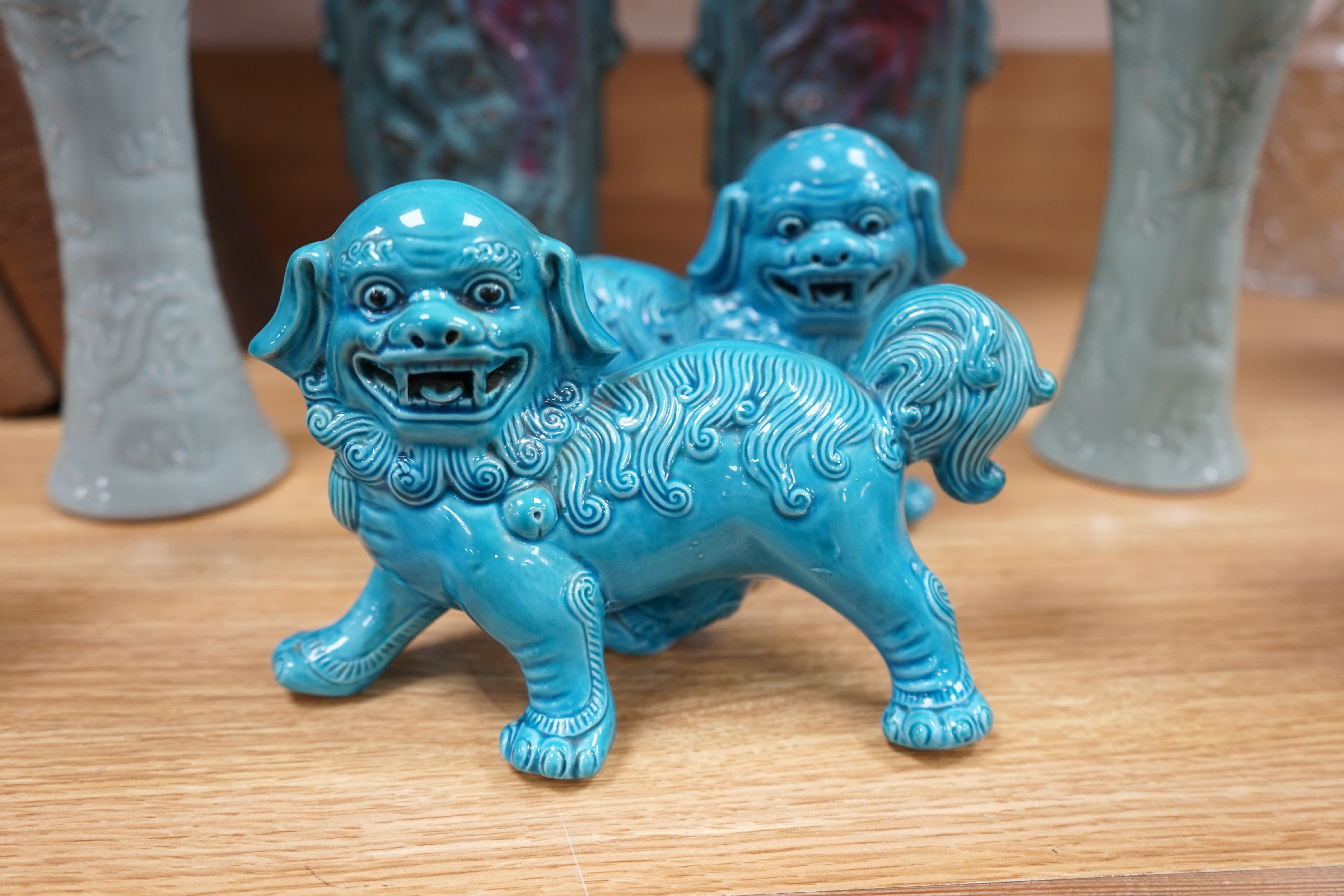 Eight pieces of Chinese porcelain to include a pair of temple dogs, a pair of relief moulded celadon glazed vases and a pair of Sang de Boeuf vases, largest 31cm high. Condition - good